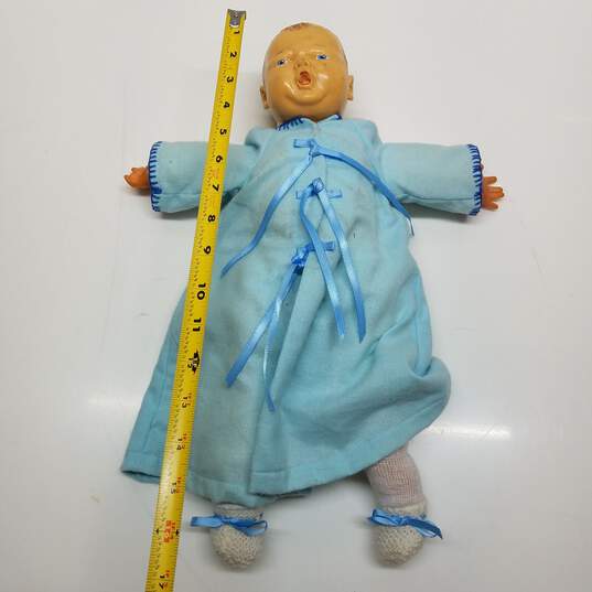 Vintage unmarked newborn baby doll in blue dress and diaper image number 2