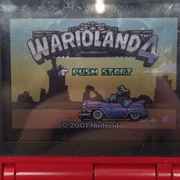 Red/Silver Nintendo DS w/Wario Land 4 alternative image