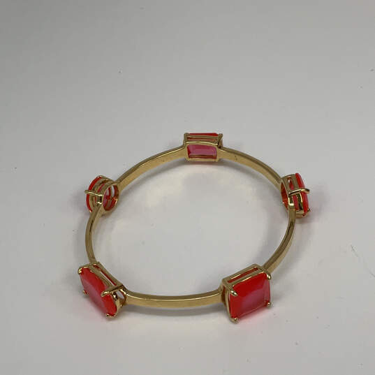 Designer Kate Spade Gold-Tone Orange Crystal Cut Stone Bangle Bracelet image number 2