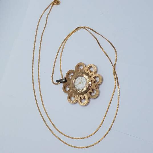 Caravelle Gold Tone Flower On Chain Vintage Automatic Manual Wind Pendant Watch image number 8