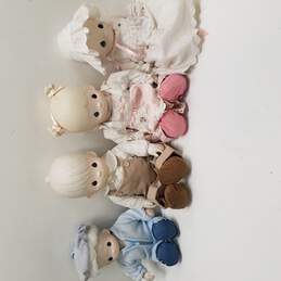 Bundle of 4 Precious Moments Porcelain Dolls