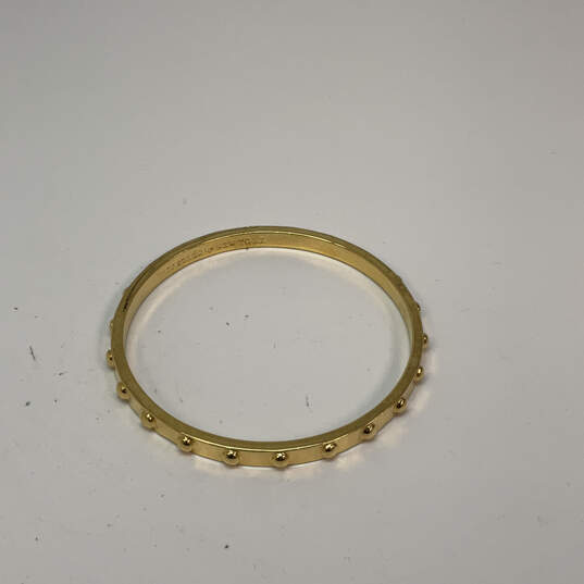 Designer Kate Spade Gold-Tone Studded Notched Classic Bangle Bracelet image number 3