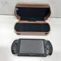 Black Sony PSP w/ Brown Leather Case image number 1