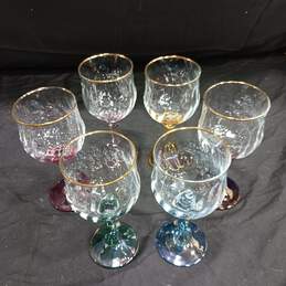 SET OF 6 GOBLETS W/ MULTICOLORED STEMS & GOLD TONE RIM ON GLASSES