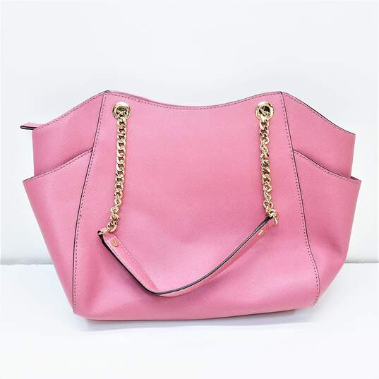 Buy the Michael Kors Pink tote bag with Gold tone Straps