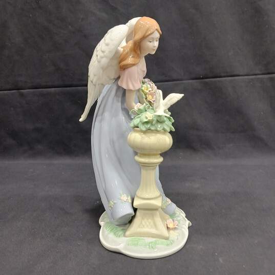 Figurine of Women With Wings Looking At Dove image number 2