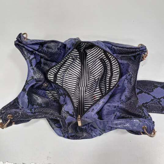 Charming Charlie Purple And Black Faux Snakeskin With Striped Lining Handbag image number 6