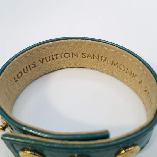 Buy the Louis Vuitton Vinyl Felt Metallic Turquoise A Gold Band