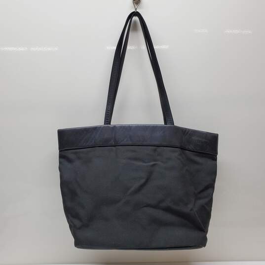 TUMI Large Travel Tote in Black with Black Leather Detail & Trim image number 2