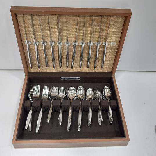 International Stainless Silverware in Wooden Chest image number 1