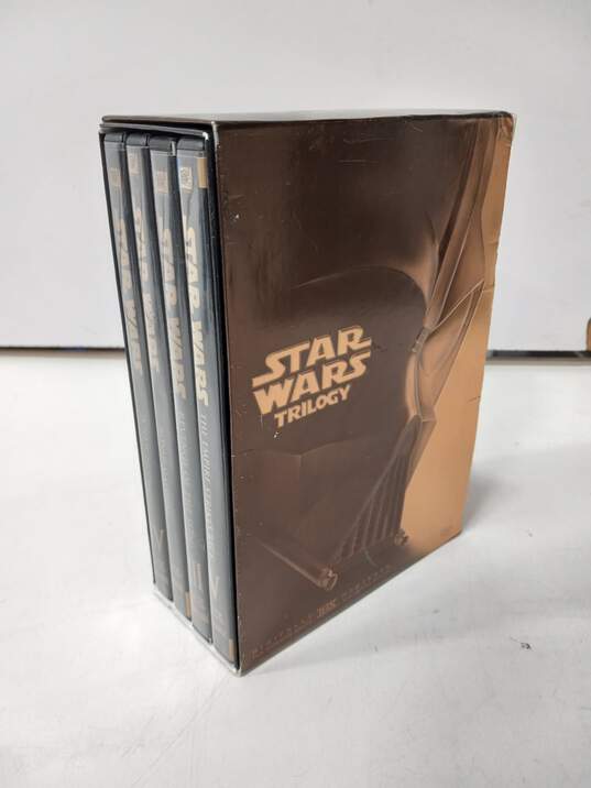 2 Star Wars Trilogy DVD Box Sets Gold & Black image number 3