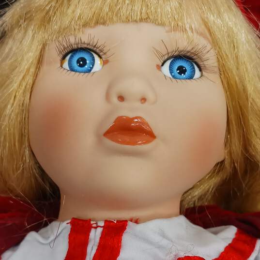 Unbranded Porcelain Doll With Blue Eyes, Curly Blonde Hair, Multicolor Plaid Dress, Red Coat And Hat, Black Shoes, And White Socks And Bloomers image number 4