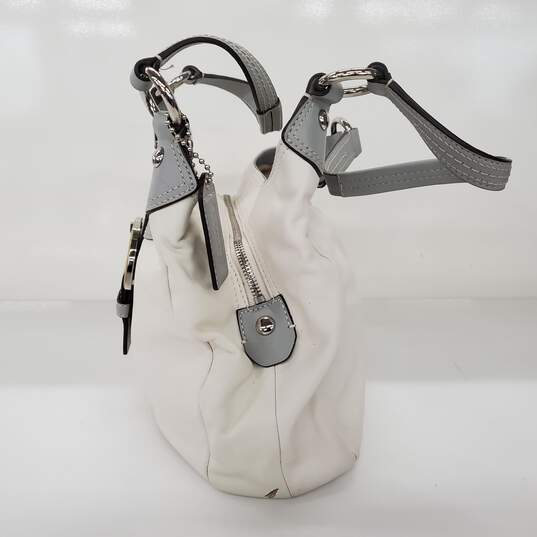 Moderate wear with some scuffs and scratches.  Coach Soho Lynn Soft White Leather Gray Trim Hobo Shoulder Bag image number 2