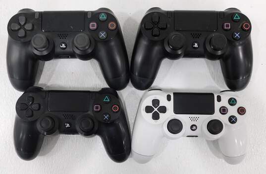 4 Used Sony Dualshock 4 Controllers image number 1
