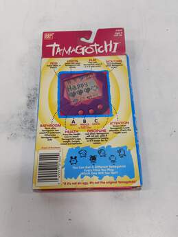 Bandai 1996-1997 Vintage Tamagotchi Yellow Electronic Game IOB alternative image