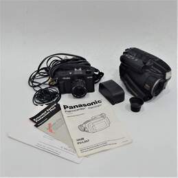 Panasonic PalmSight PV-L557 VHS-C Handheld Video Camera W/ Manuals & Accessories & Ninoka NK-700 W/ 50mm Lens