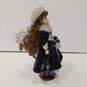 Vintage Porcelain Doll w/Clothing and Stand image number 5