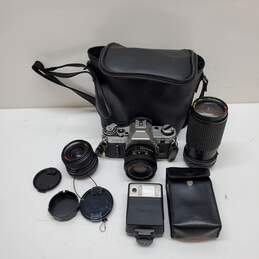 UNTESTED Sliver/Black Canon AE-1 Film Camera Bundle with 3 lenses, Flash & Bag
