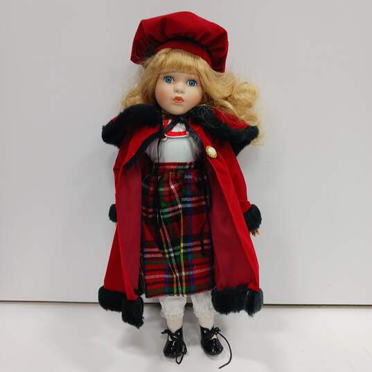 Unbranded Porcelain Doll With Blue Eyes, Curly Blonde Hair, Multicolor Plaid Dress, Red Coat And Hat, Black Shoes, And White Socks And Bloomers image number 5