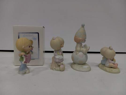 4 Precious Moments Figurines image number 2