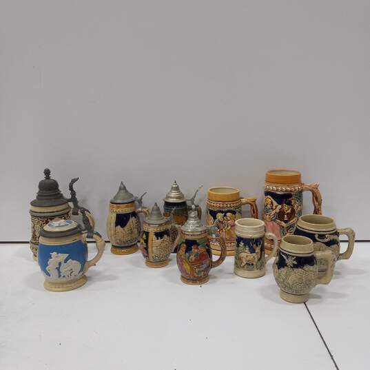 Lot of 11 Assorted Sizes German Beer Steins & Mugs image number 1
