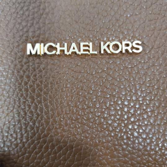 Women's Michael Kors Brown Backpack image number 4