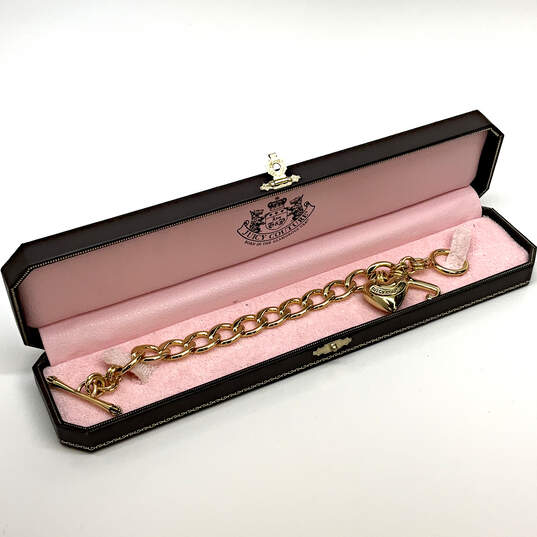 Buy the Designer Juicy Couture Gold-Tone Toggle Heart Charm Chain Bracelet  With Box