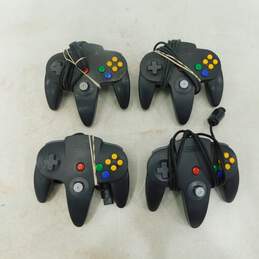4 Nintendo 64 Black Controllers