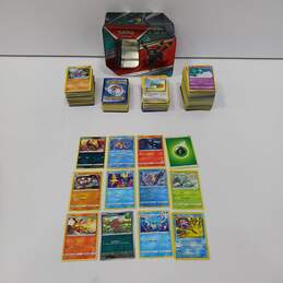 Lot of Assorted Nintendo Pokémon Trading Card Singles in Collector Tin