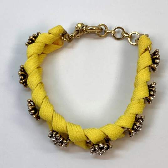 Designer J. Crew Gold-Tone Crystal Pave Yellow Ribbon Wrapped Chain Bracelet image number 2