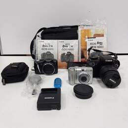 Bundle of 3 Canon Cameras With Accessories And Case