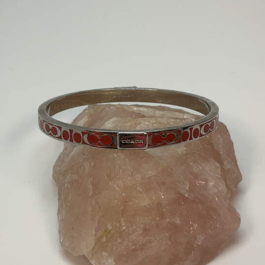 Designer Coach Silver-Tone Red Thin Fashionable Slide On Bangle Bracelet image number 1