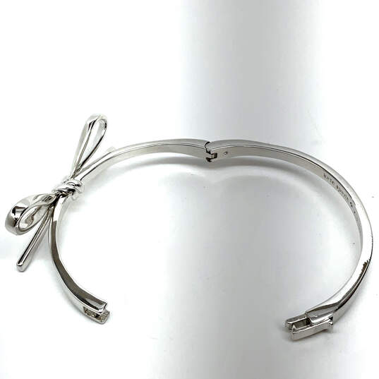 Designer Kate Spade Silver-Tone Bow Hinged Bangle Bracelet With Dust Bag image number 2