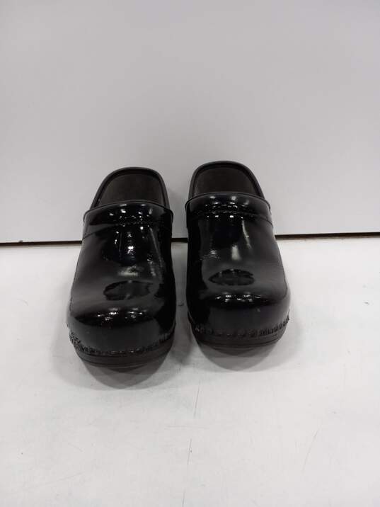 Dansko Black Patent Leather Clogs Women's Size 40/US Size 9 image number 1