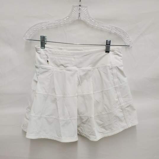 Lululemon Athletica WM's Mid-Rise Snow White Tennis Skirt Size 4 Tall image number 2