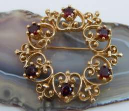 14K Yellow Gold Faceted Garnet Open Scrolled Circle Brooch 9.2g