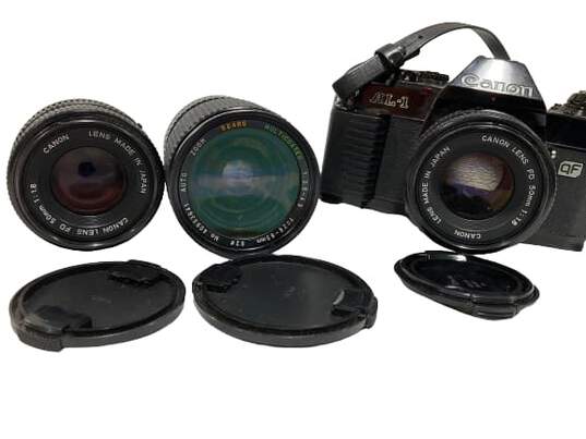 Canon AL-1 Film Camera w/ 3 Lenses [broken battery door] image number 2