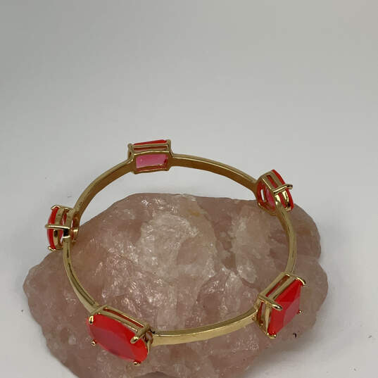 Designer Kate Spade Gold-Tone Orange Crystal Cut Stone Bangle Bracelet image number 1