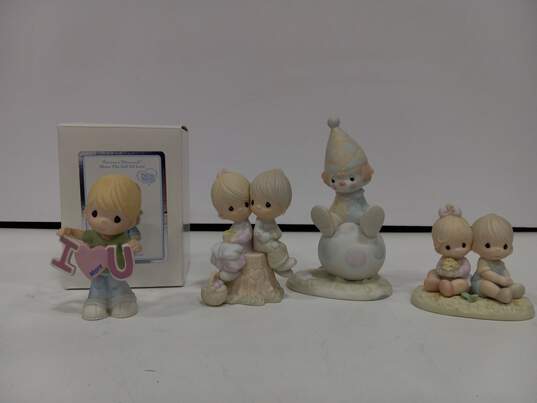 4 Precious Moments Figurines image number 1