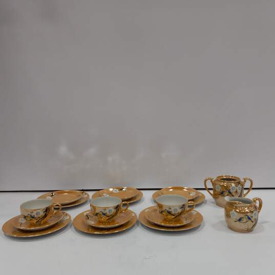 Bundle of 12 Assorted Peach Tone Ceramic Floral Plates w/3 Matching Cups and Matching Cream and Sugar Sets image number 1