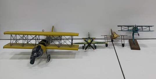 Bundle of Four Metal Airplane Figurines image number 1