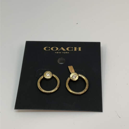 Designer Coach Gold-Tone Clear Crystal Stone Screw Back Hoop Earrings image number 4