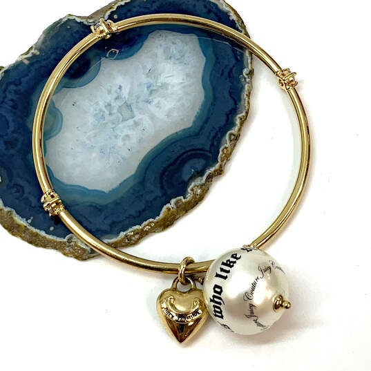 Buy the Designer Juicy Couture Gold-Tone Heart Charm Classic Bangle Bracelet  w/ Box