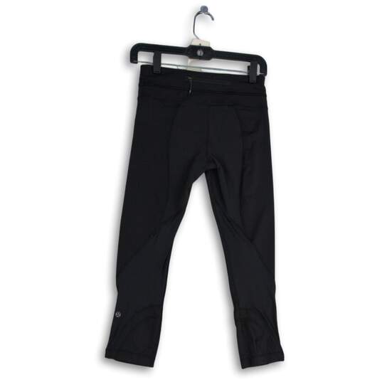 Womens Black Elastic Waist Zipper Pocket Pull-On Cropped Leggings Size 4 image number 2