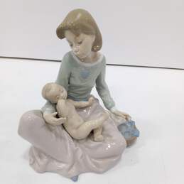 Vintage Lladro Dressing The Baby Figure