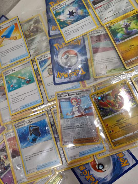 Bundle of Assorted Pokémon Cards In Tin & Sleeves image number 5