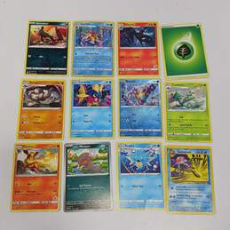 Lot of Assorted Nintendo Pokémon Trading Card Singles in Collector Tin alternative image