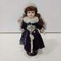 Vintage Porcelain Doll w/Clothing and Stand image number 1