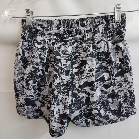 Buy the Lululemon women's high waisted abstract print running shorts size 4