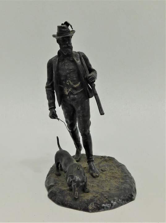 Unbranded Hunter Walking Dog Bronze Sculpture image number 1
